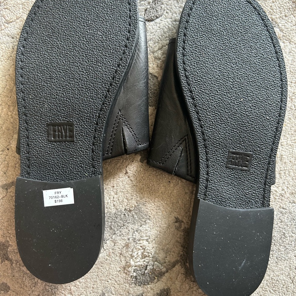 Never been worn Frye slides. They are in excellent condition.